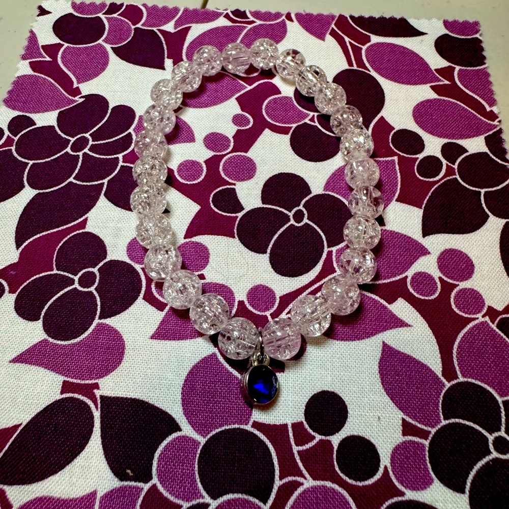 Clear beads with blue birthstone